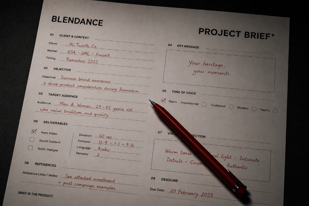 Project brief form filled in red ink with a red pen on a dark desk, BLENDANCE header visible